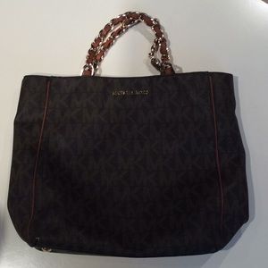 Lightly used Michael kors leather purse -MK print-